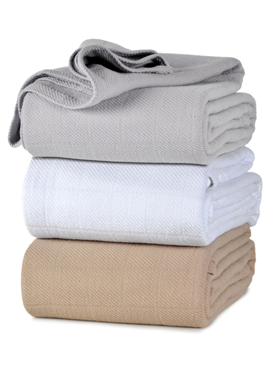 Three Allsoft cotton blankets in three different colors folded and stacked on one another