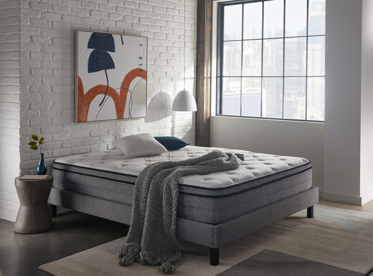 Lifestyle image of mattress in gray decor